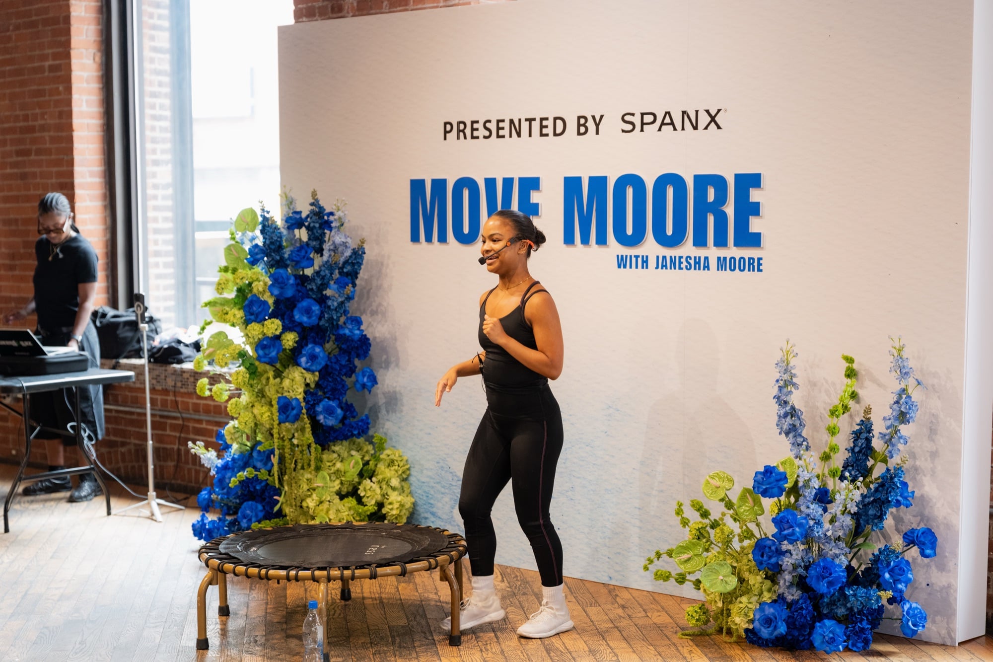 Janesha leading the room from the Move Moore stage